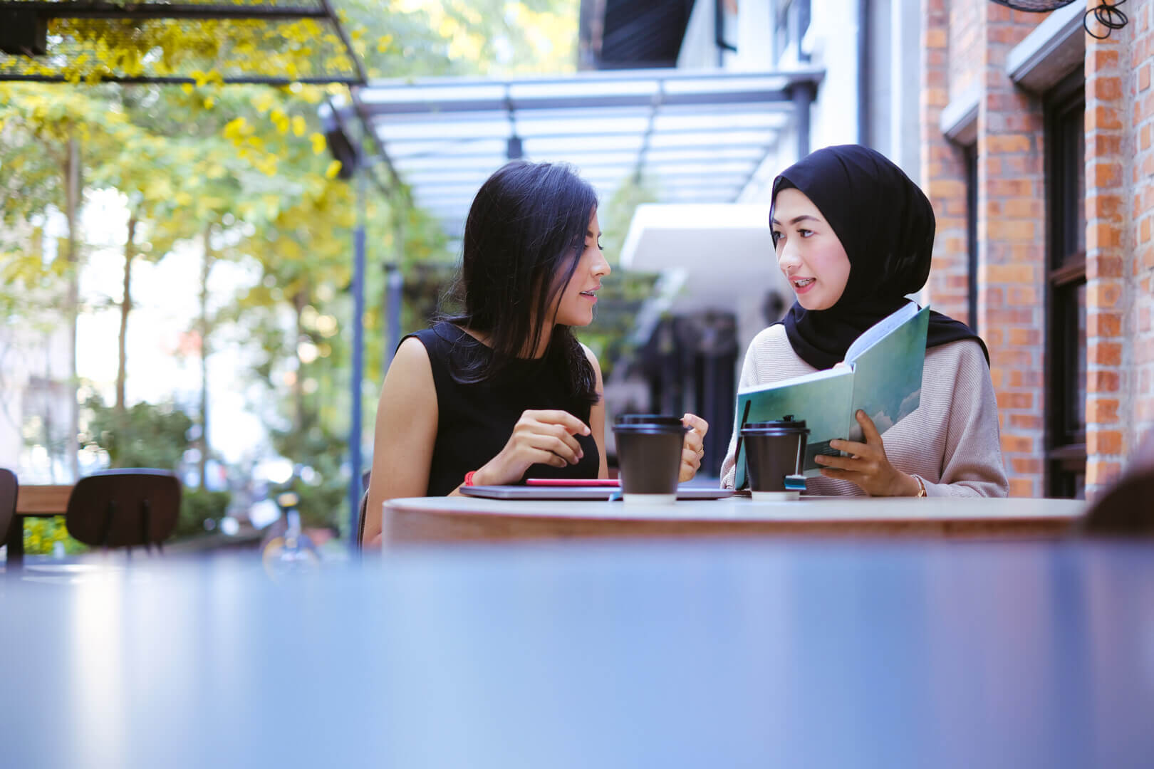 two young female having group study