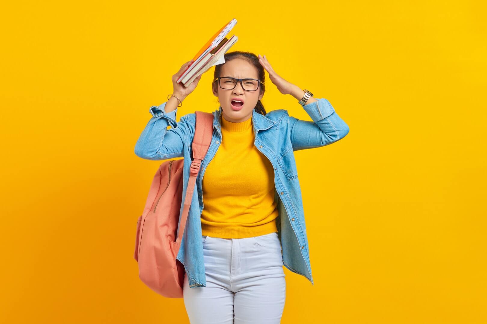 dizzy,young,woman,student,in,denim,clothes,with,backpack,,putting