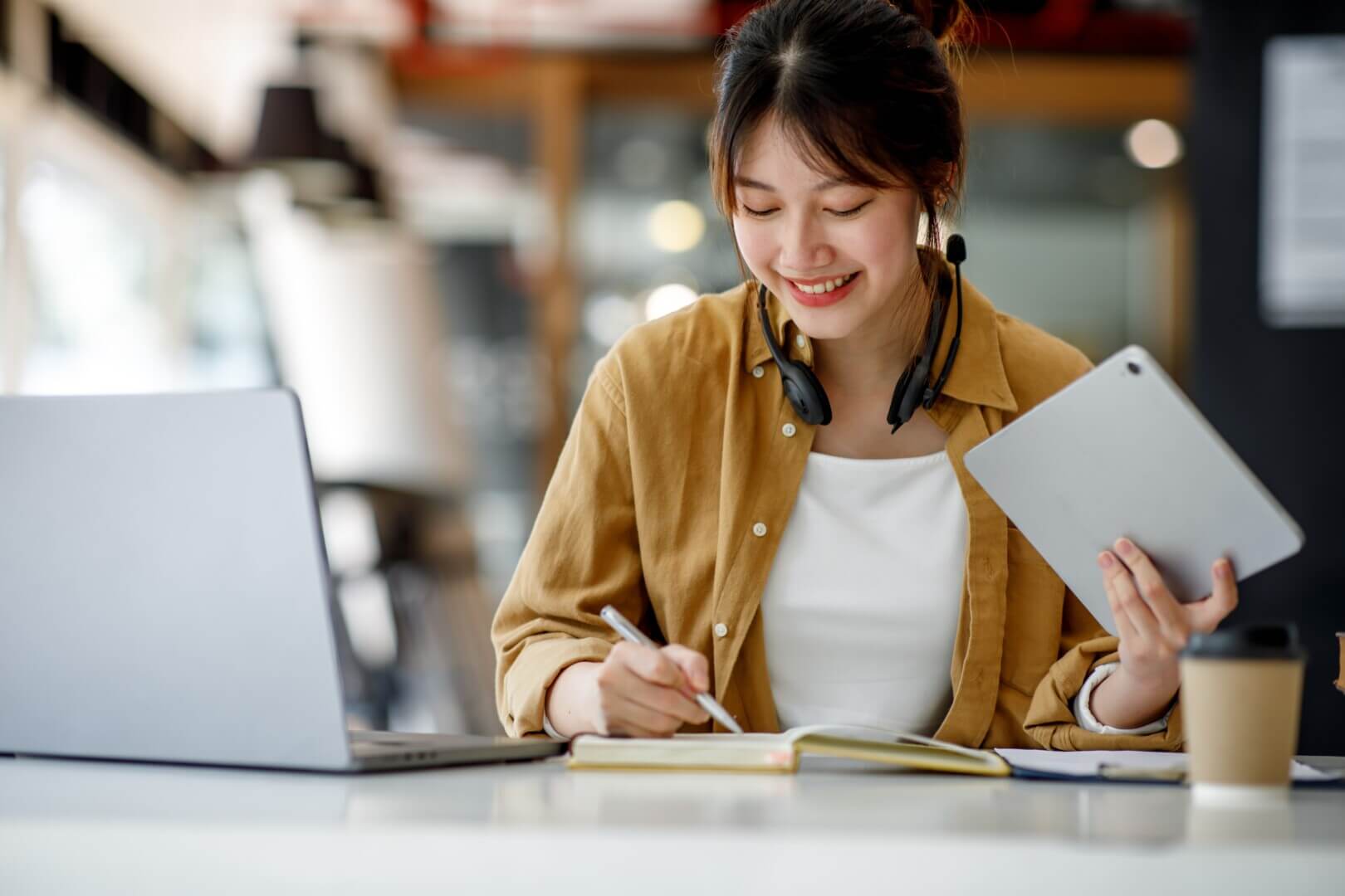 young,adult,happy,smiling,hispanic,asian,student,wearing,headphones,talking